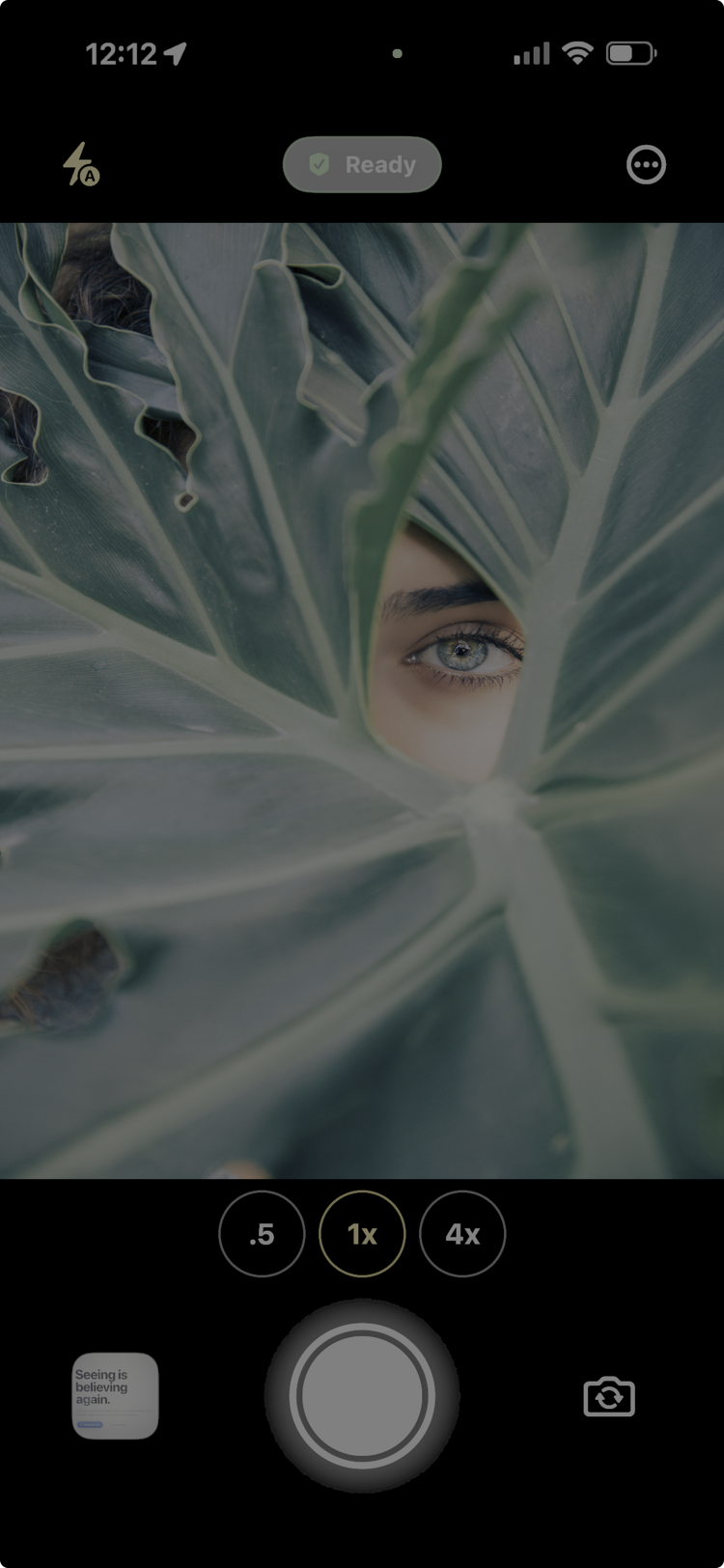 Verithia app camera view showing a captured photo framed by leaves